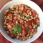 Summer salad of tomatoes, white beans, basil, and garlic
