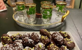 No Bake easy Persian dessert dark chocolate covered dates stuffed with pistachios and walnuts. Garnish with nuts or shredded coconut. Serve with hot mint tea. BeatsEats.com