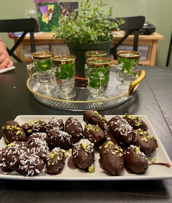 No Bake easy Persian dessert dark chocolate covered dates stuffed with pistachios and walnuts. Garnish with nuts or shredded coconut. Serve with hot mint tea. BeatsEats.com