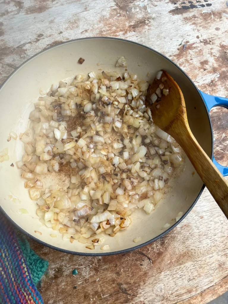 Caramelized onions cooking in a pan for Persian khoresht bademjan
