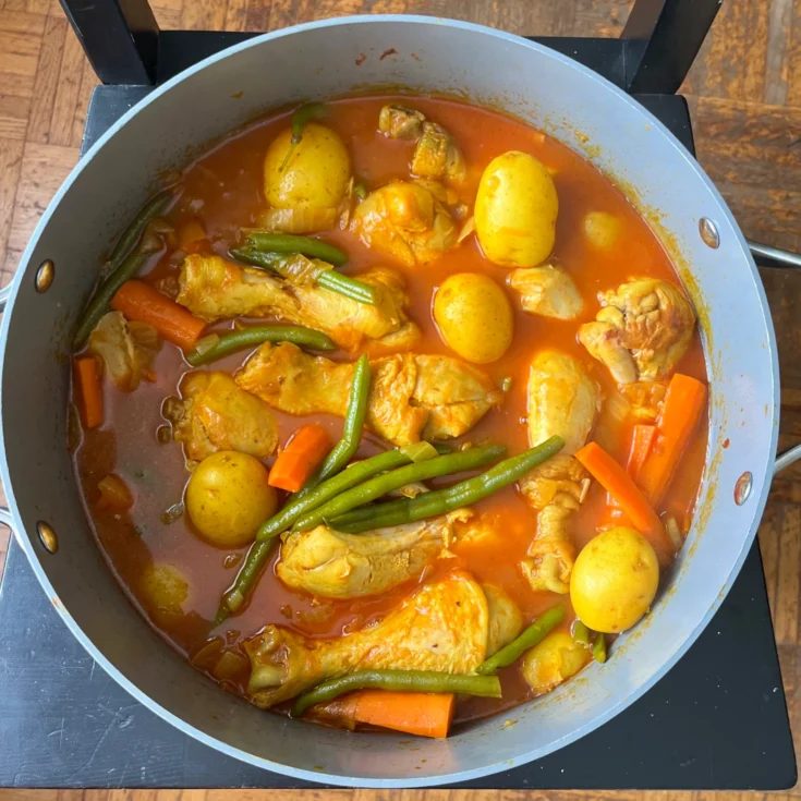 Persian Khorak Morgh chicken and vegetable stew simmering on the stovetop