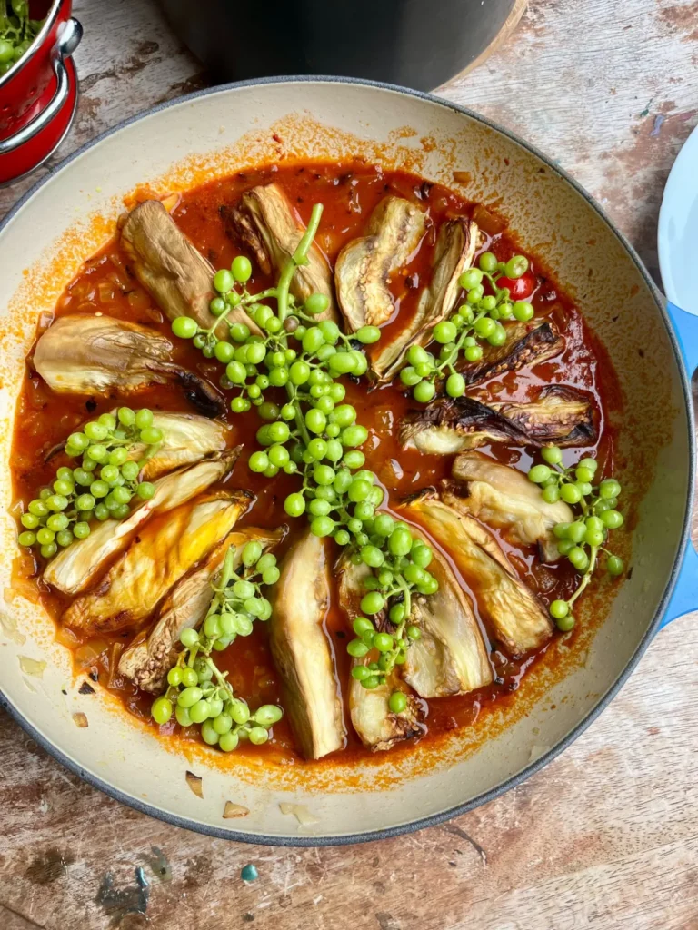 Persian khoresht bademjan cooking with ghooreh sour unripe grapes